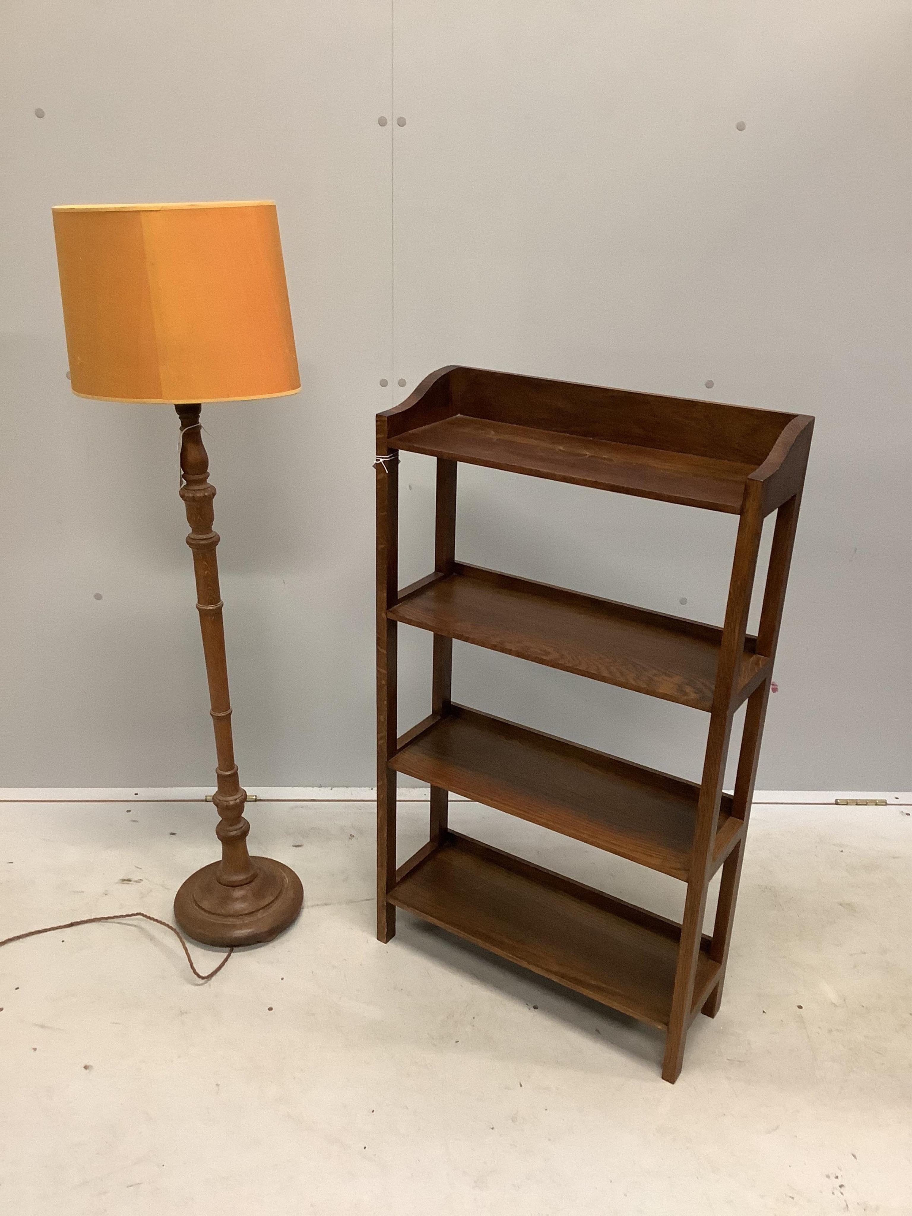 A 1930's oak lamp standard and an open bookcase, width 56cm, depth 20cm, height 98cm. Condition - good